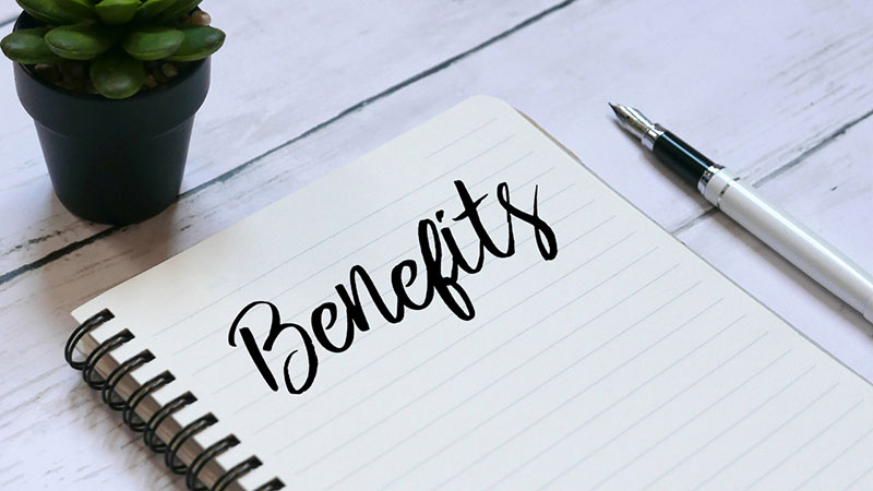 Benefits written on notepad in cursive writing 