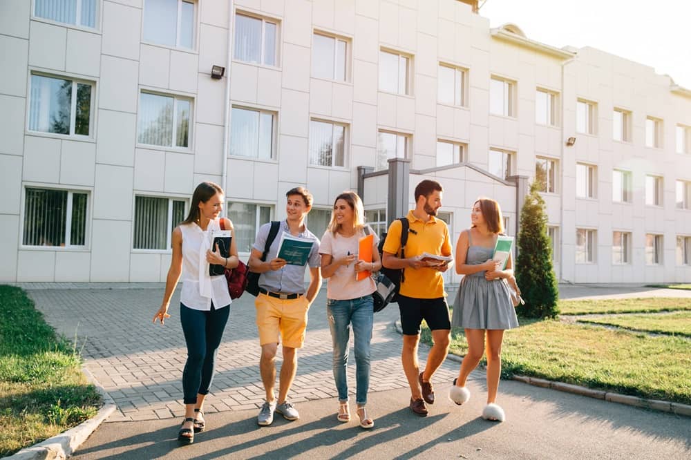 Student walking outside of the building 