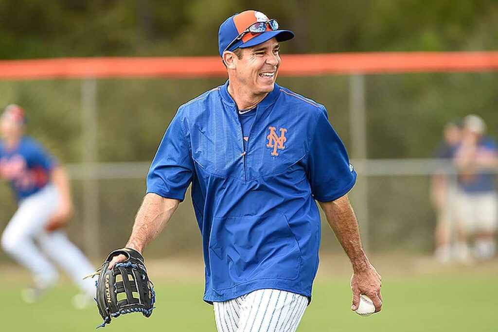 Billy playing baseball in the field with ball in hand