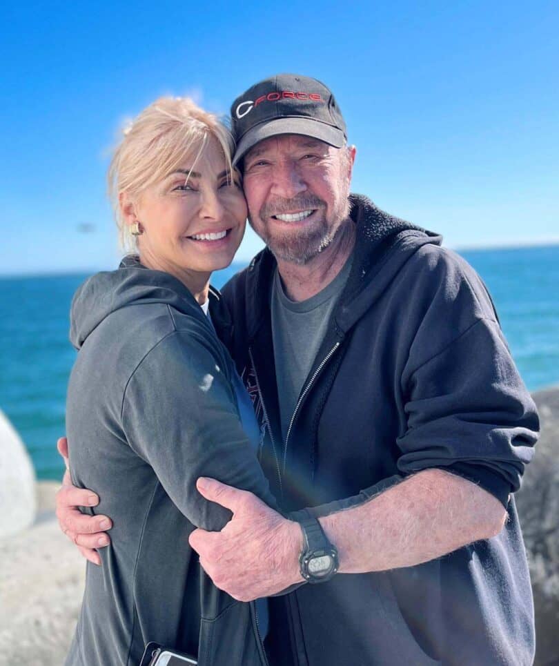 Chuck Norris and Gena O'Kelley on the beach